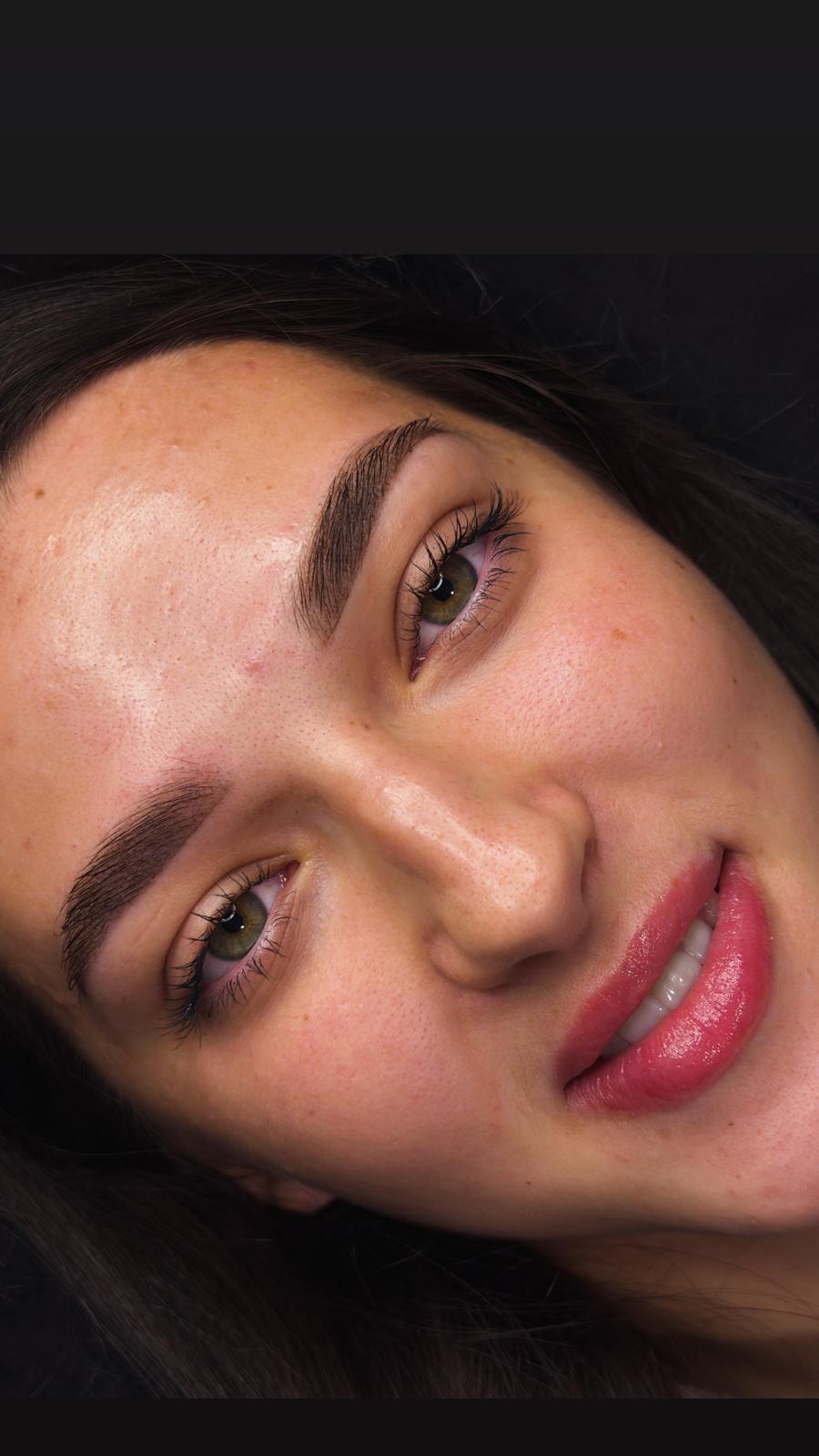 Client showing lip blush and brow results